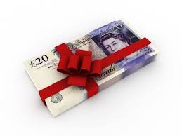 Bundle of £20 notes wrapped with red ribbon